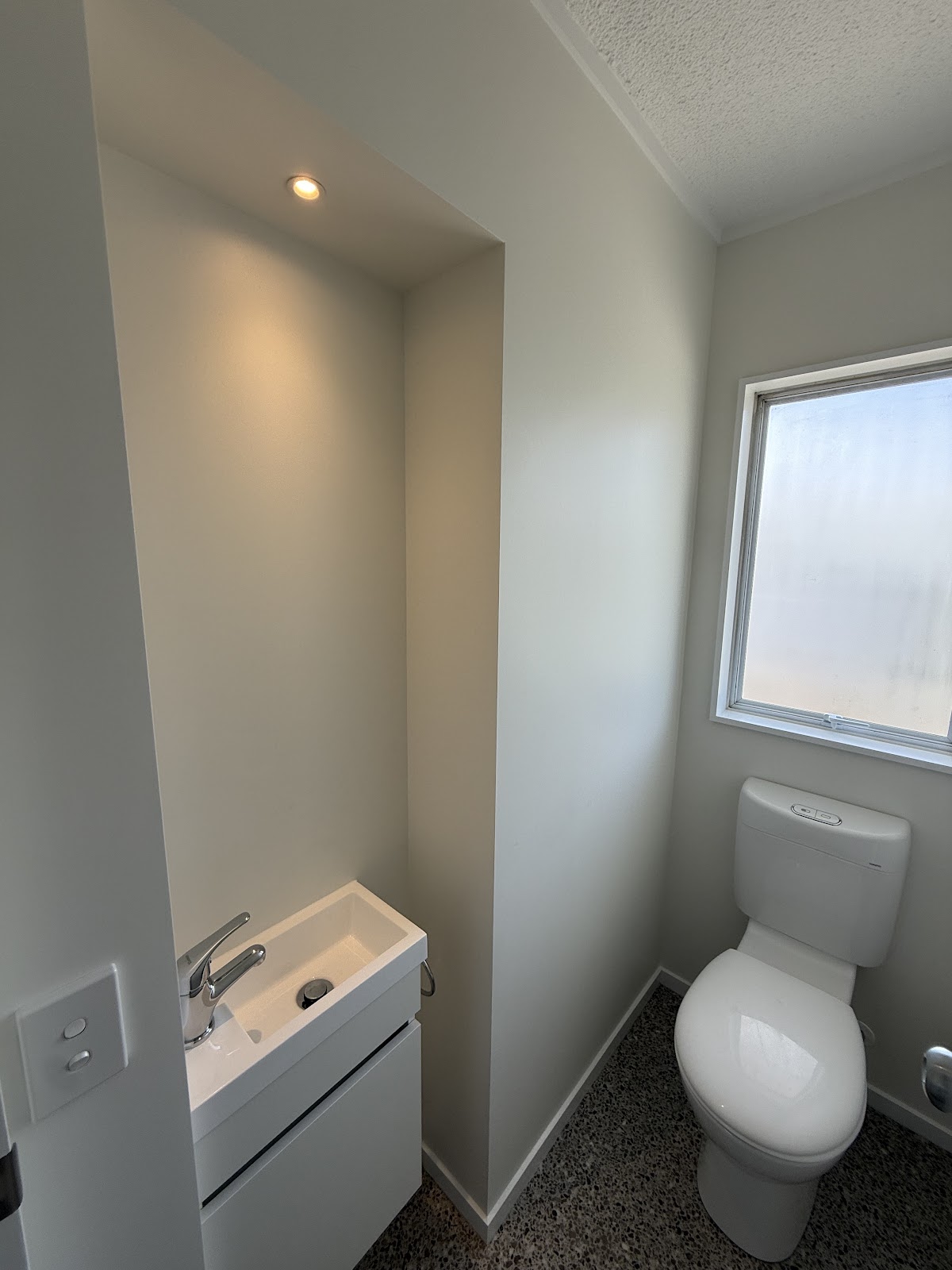 Compact bathroom with recessed downlight