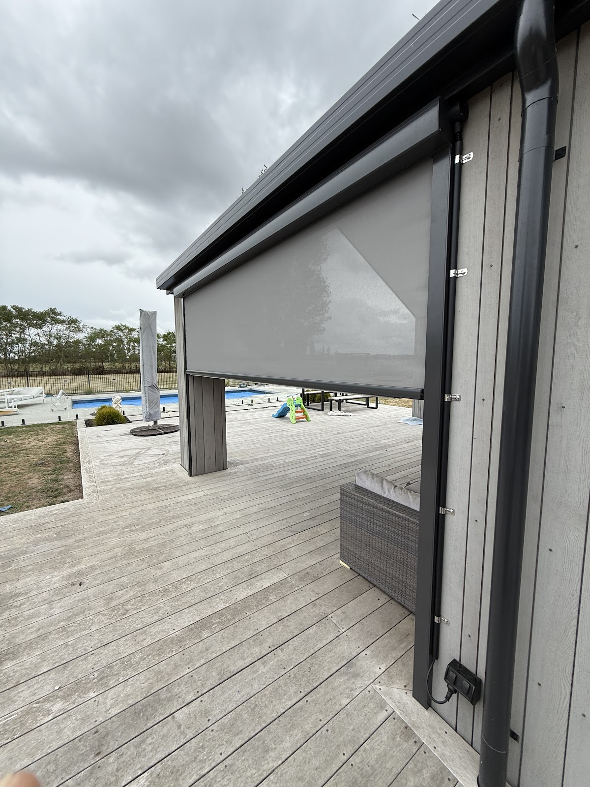 Outdoor pergola with motorised screen and weatherproof power point